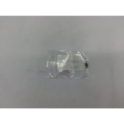 A white rectangular electronic module sealed in clear plastic packaging for lockscrew ad5-320 121322sm use