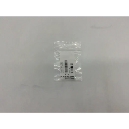 Clear plastic bag containing a black lockscrew ad5-319 121322sm labeled with barcode and text ax5 56-17506 lockscrew