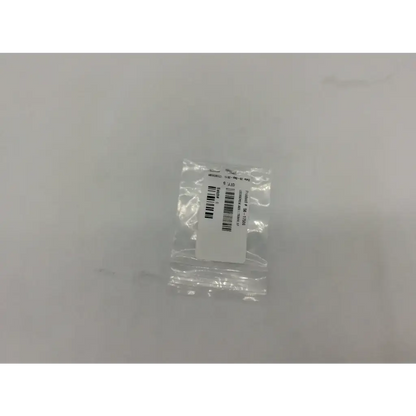 A clear plastic bag containing a white label with barcode for axs 56-17506 lockscrew ad5-319 121322sm product