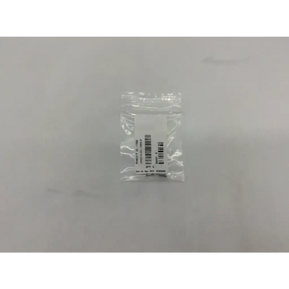 A clear plastic bag containing a metallic ad5-319 lockscrew labeled axs 56-17506 with product and barcode details