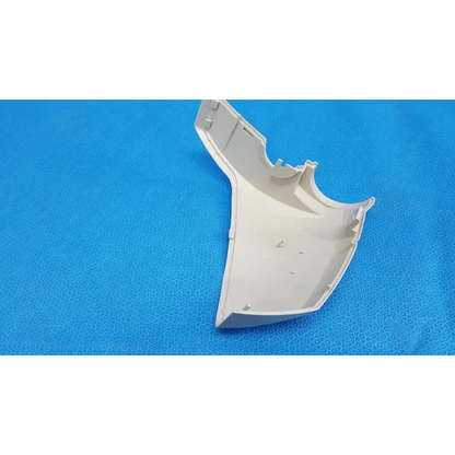 Off-white plastic base arm joint cover housing left side with molded edges and cutouts for topcon trc-nw8 retinal camera