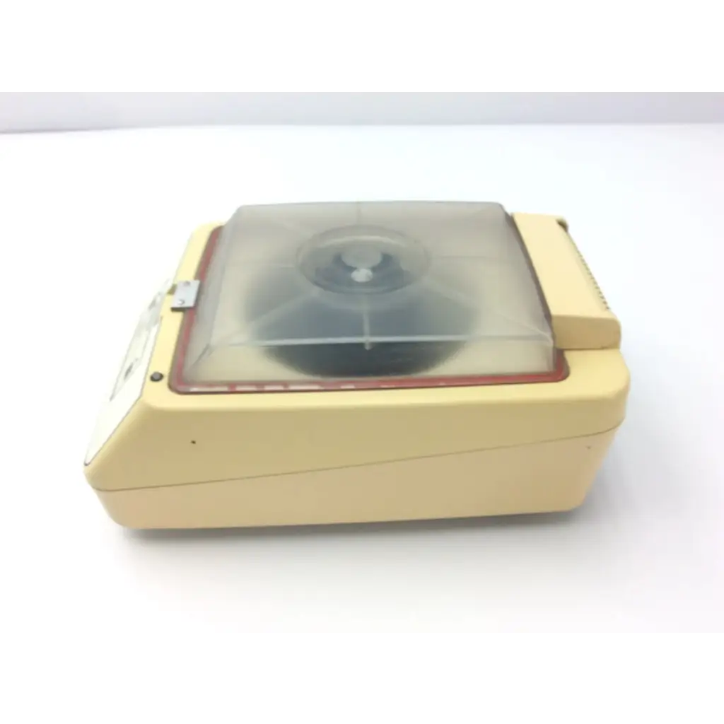 Cream-colored plastic baxter stat 60 centrifuge af5-31 with transparent lid and red trim for laboratory use