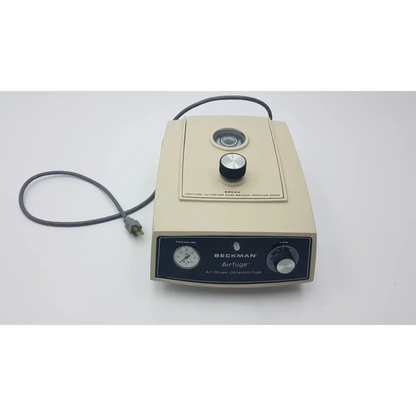 Beige beckman airfuge air-driven ultracentrifuge 340400 with black control knobs and dials for laboratory use