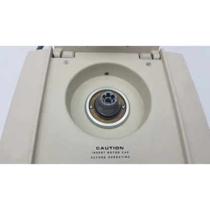 Beckman Airfuge air-driven ultracentrifuge with beige plastic body silver metal rotor cap and black central hub