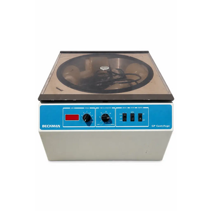 Beckman CP centrifuge with blue control panel beige body and transparent lid showing internal rotor biomed certified medical equipment