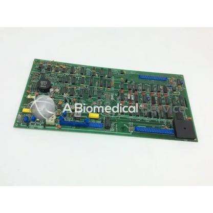 Beckman TL-100 ultracentrifuge pcb data board assy with green circuit board, black and blue components, yellow connectors, and silver capacitor