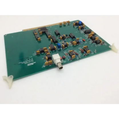 Green printed circuit board of becton dickinson fsc amplifier with black yellow components white connector and beige clips