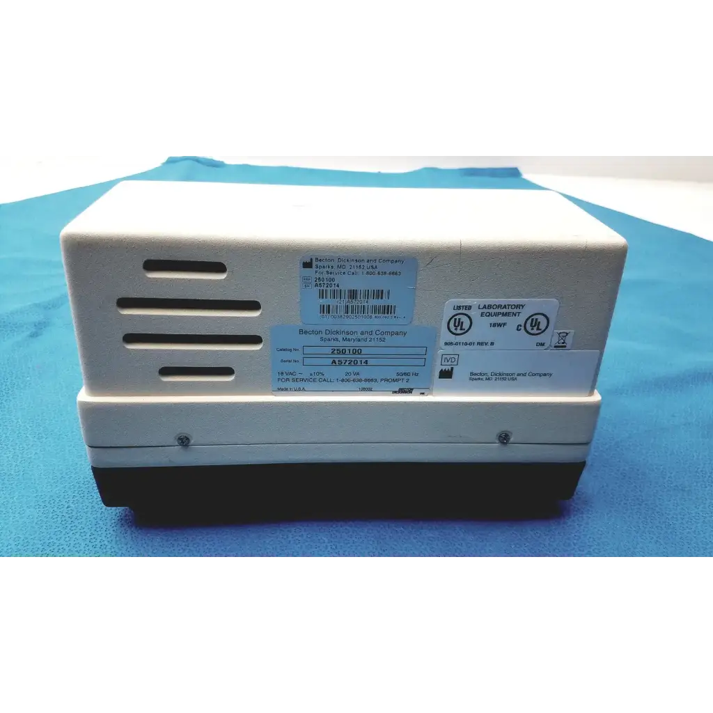 White and black becton dickinson microprobe 250100 processor with ventilation slots and jerome power supply unit