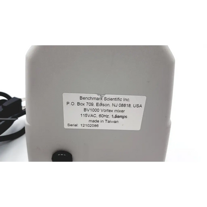 White plastic benchmark scientific bv1000 vortex mixer with label showing specifications and manufacturing details