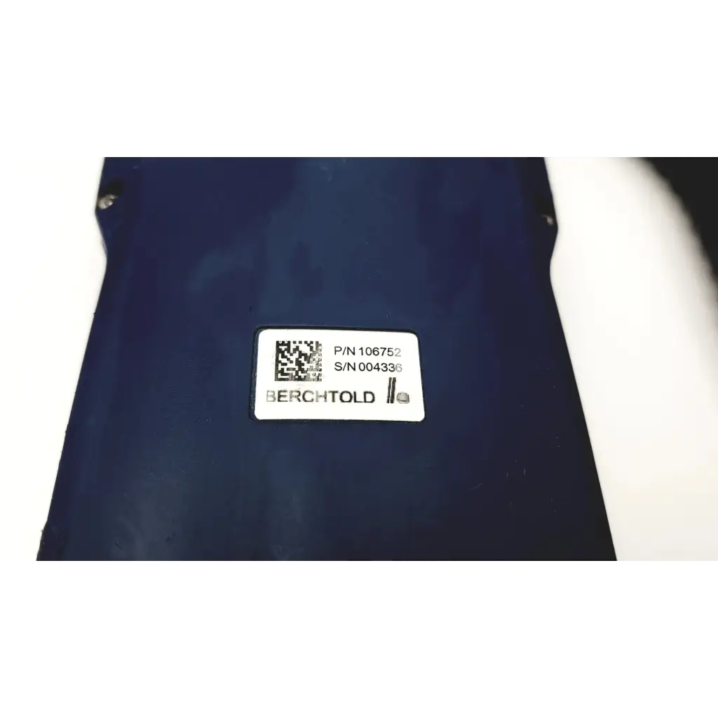 Dark blue berchtold surgical table remote d830 d850 control with white label showing part and serial numbers