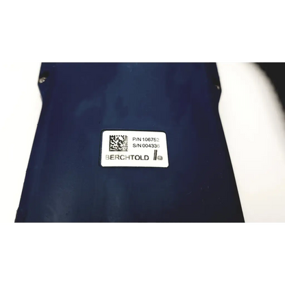 Dark blue berchtold surgical table remote d830 d850 control with white label showing part and serial numbers