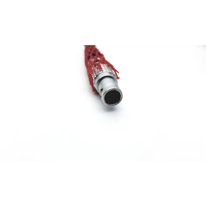 Backside of berchtold surgical table remote d830 d850 control with red mesh covered bnc connector and metallic housing