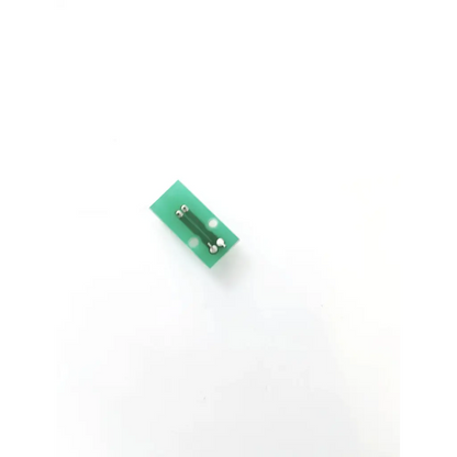 Green rectangular bhb-2625-01 control board with silver soldered connectors and two white circular markings