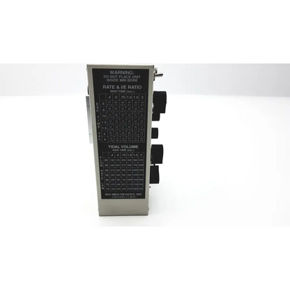 Silver metallic bmd ic-2a vent system with black label displaying rate and tidal volume settings by devices bmd
