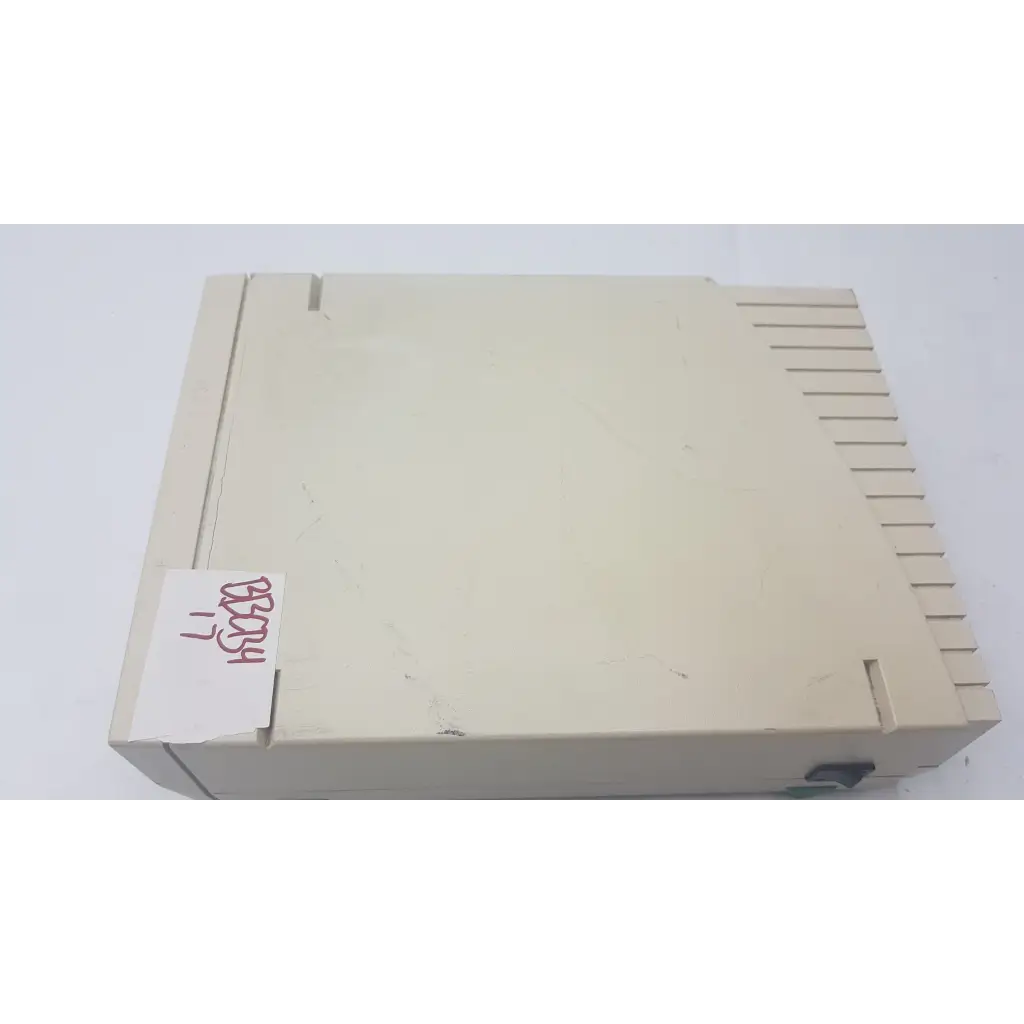 Beige plastic atari 2600 console with vertical slotted design shown alongside bio-rad powerpac 300 electrophoresis power supply