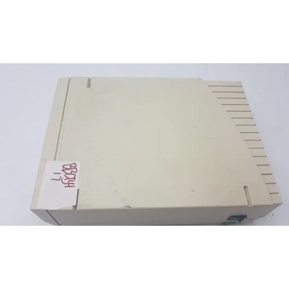 Beige plastic atari 2600 console with vertical slotted design shown alongside bio-rad powerpac 300 electrophoresis power supply