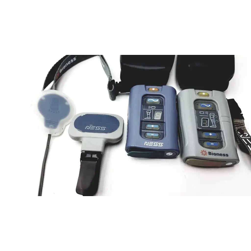 Blue and gray bioness l300 plus wireless communication devices with button controls for thigh cloth electrodes use