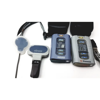 Blue and gray bioness l300 plus wireless communication devices with button controls for thigh cloth electrodes use