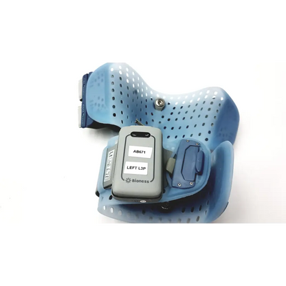 Blue perforated orthopedic brace with gray bioness l300 plus device and thigh cloth electrodes attached