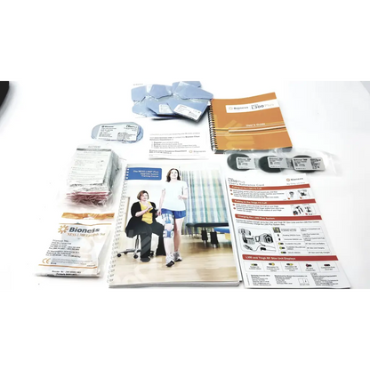 Bioness l300 plus knee support system with black thigh cloth electrodes, instructional manual, and accessory components