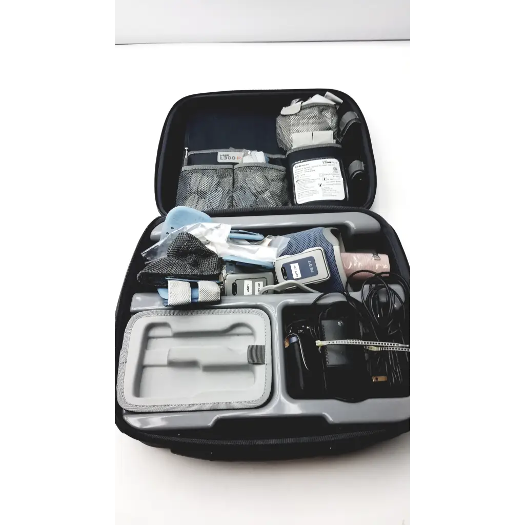 Black and gray travel case with bioness l300 plus thigh cloth electrodes medical equipment inside