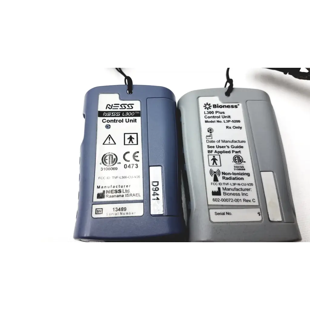 Two medical control units in blue and gray with bioness l300 plus thigh cloth electrodes labels showing model and certifications