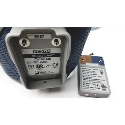 Gray plastic bioness l300 plus orthosis device with thigh cloth electrodes and white label showing model and serial number