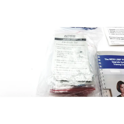 A clear plastic package of red and white thigh cloth electrodes for bioness l300 plus l3p-5d00 device
