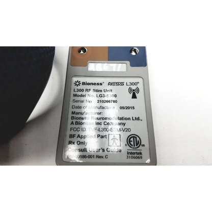 Silver-colored bioness l300 plus rf stim unit with model and regulatory labels for thigh cloth electrodes use