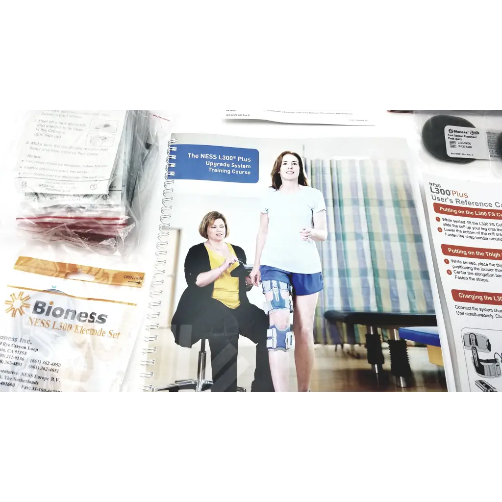 Bioness l300 plus knee brace with blue and gray adjustable straps featuring thigh cloth electrodes for support and therapy