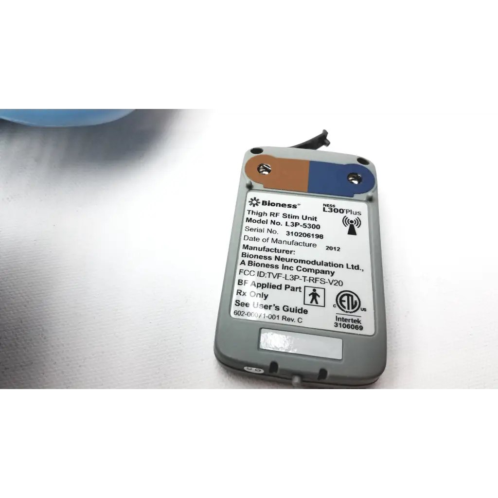 Gray and blue bioness l300 plus thigh cloth electrodes with white label showing model and regulatory details