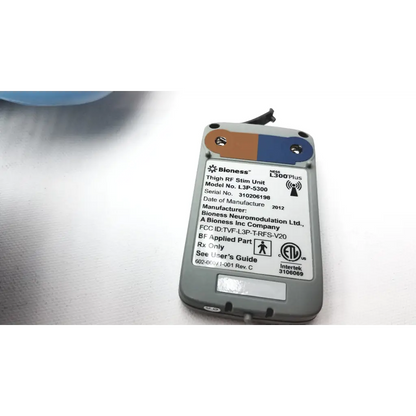 Gray and blue bioness l300 plus thigh cloth electrodes with white label showing model and regulatory details