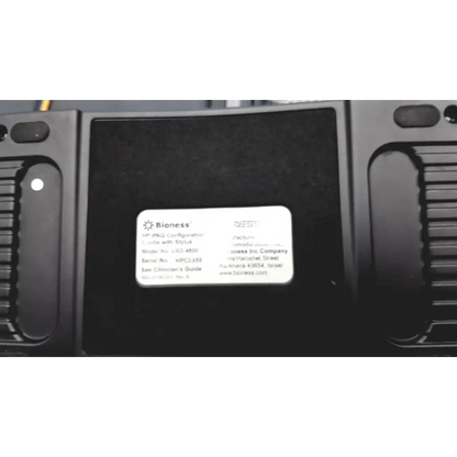 Black bioness ness h200 wireless rehabilitation device showing white label with model and serial number on the back side