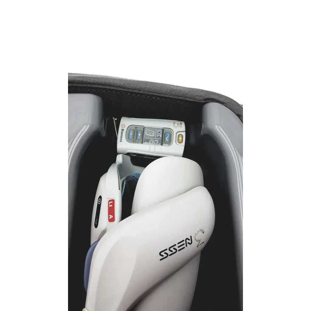 White and gray infant car seat with a control panel featuring buttons for bioness ness h200 wireless rehabilitation system