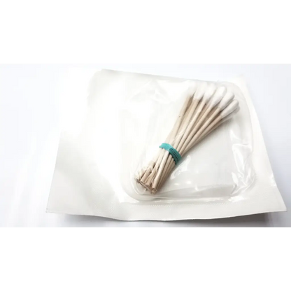 A bundle of beige bioseal 9325/100 cotton tip applicators tied with a teal elastic band showing cotton tip applicators
