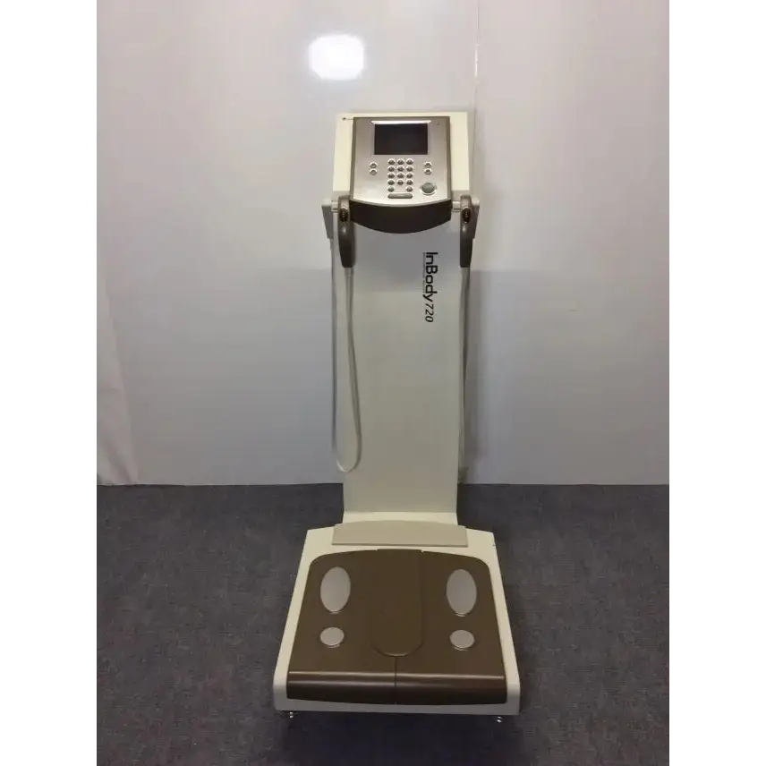 Cream-colored and brown biospace inbody 720 body composition analyzer with digital display keypad and measurement straps