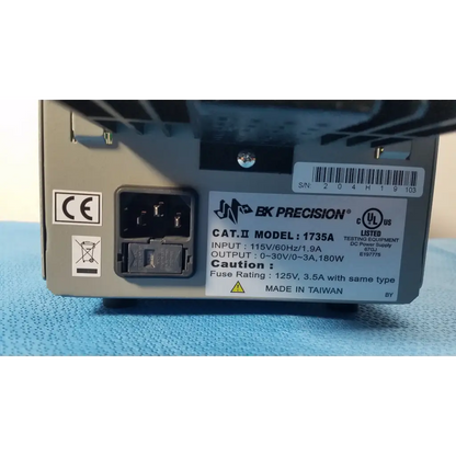 Gray metal power supply unit with black input port and white label showing bk precision 1735a 30v digital dc power specifications