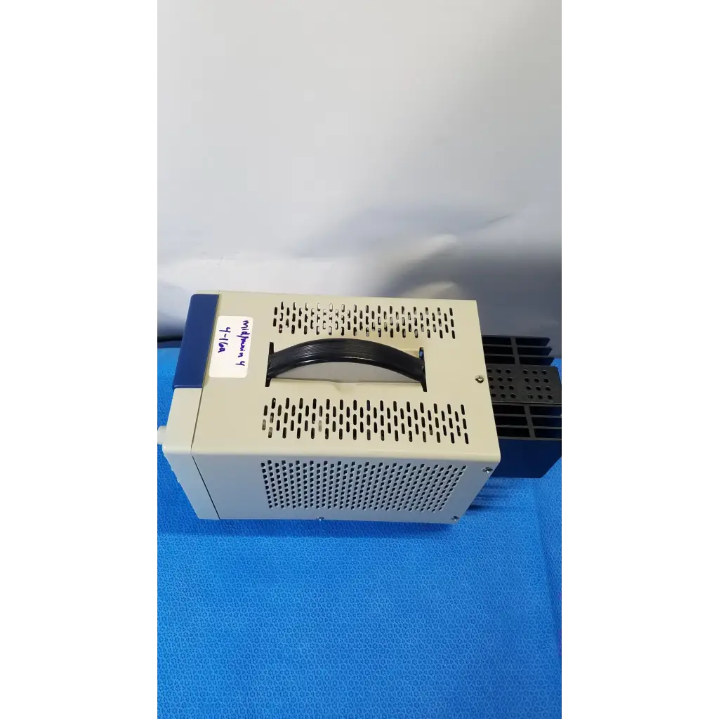 Beige and blue bk precision 1735a 30v digital dc power supply with perforated metal casing and magnifier y 4-10x label