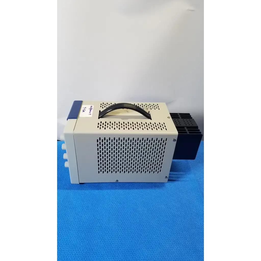 Beige and blue BK Precision 1735A 30V digital dc power supply with perforated metal casing and cooling fan module