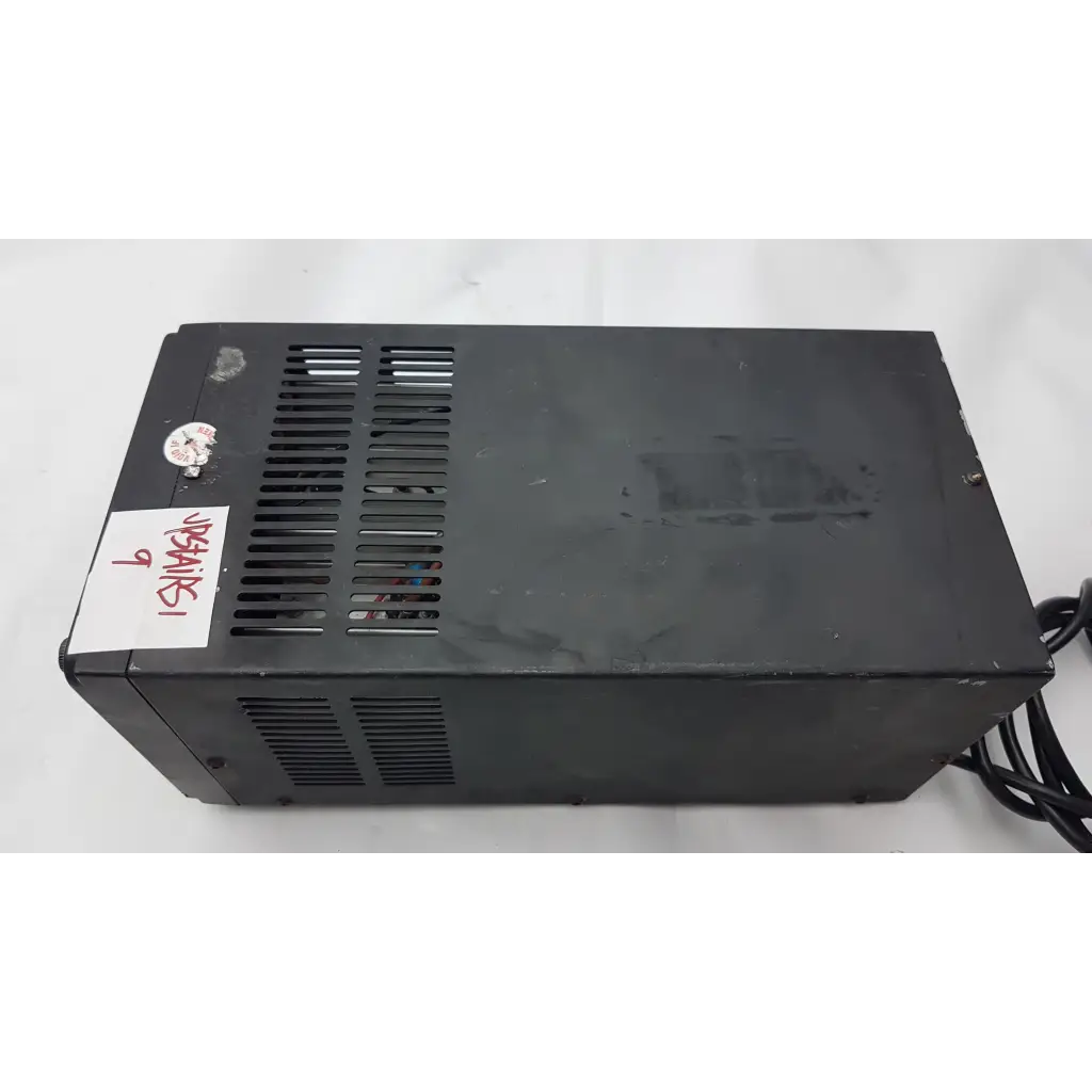Black plastic power supply unit with ventilation slits and handwritten label on the side bk precision model 1688