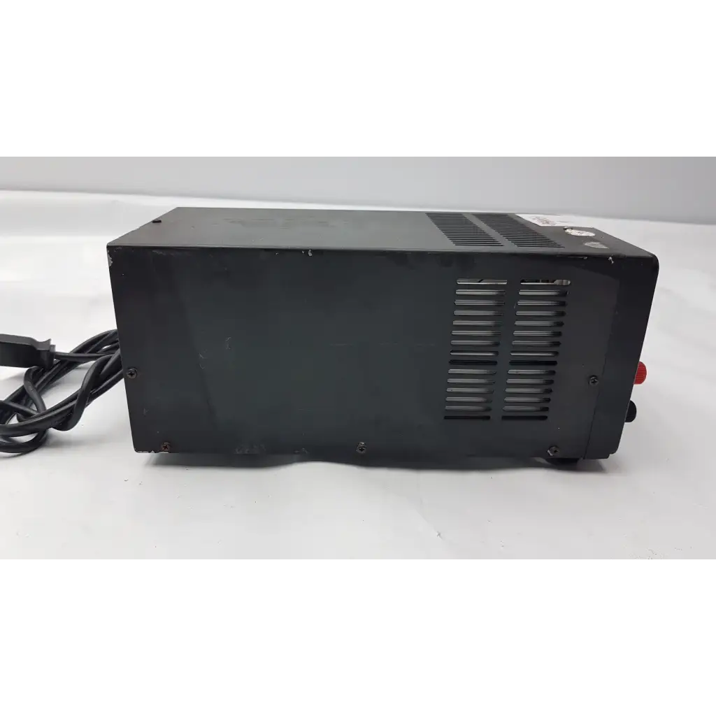 Black rectangular b&k precision model 1688 power supply unit with ventilation slats and red side button