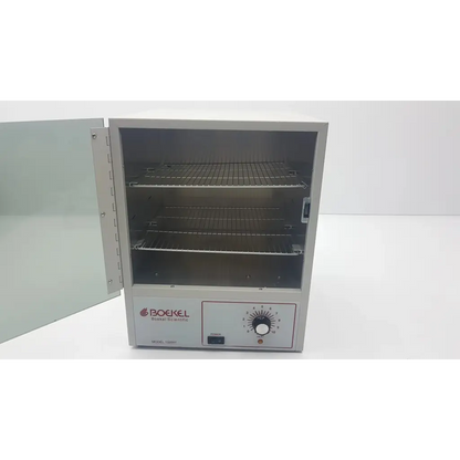 Silver metallic boekel scientific 132000 analog benchtop incubator with three wire racks and front control dial