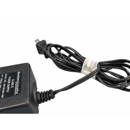 Black plastic boston acoustics dk1201a5-1an power supply adapter with coiled cord and clear tape wrap