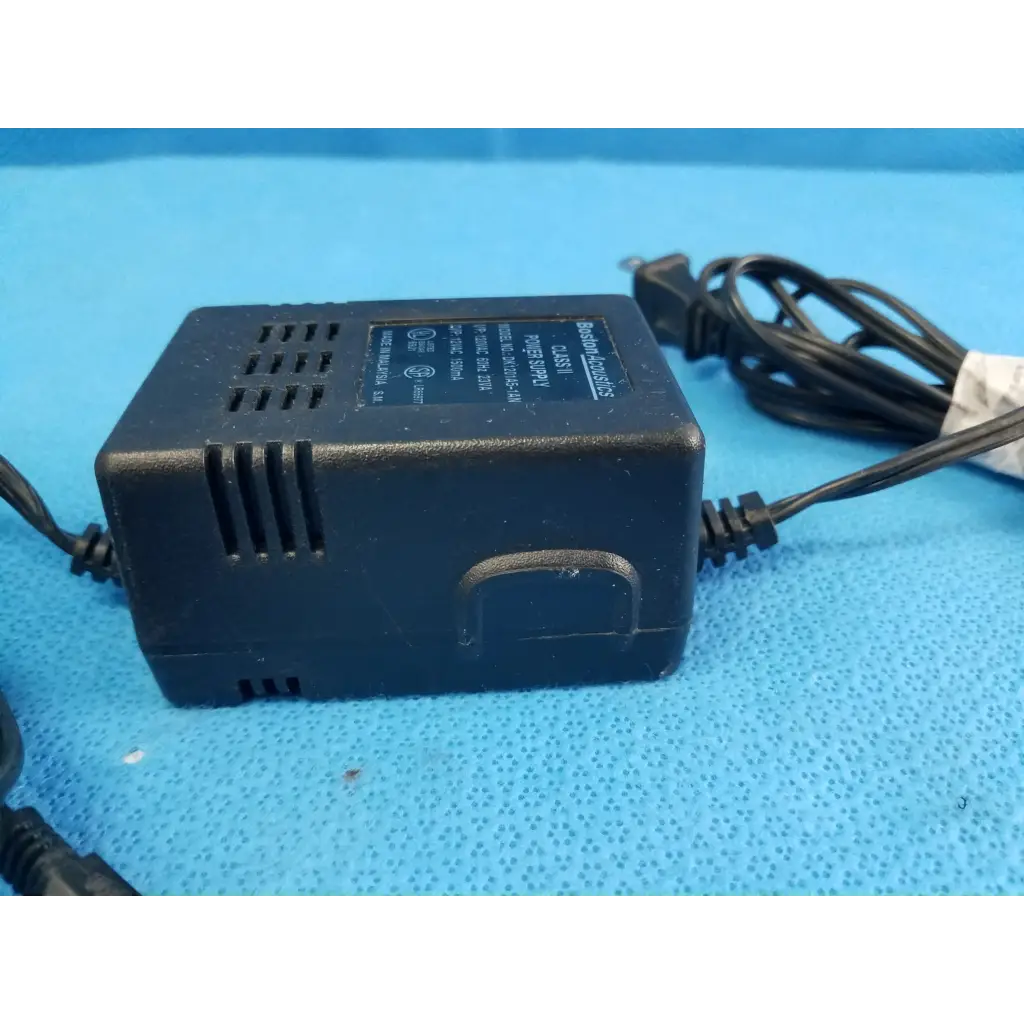 Black plastic boston acoustics dk1201a5-1an power supply with coiled cord and side ventilation slots