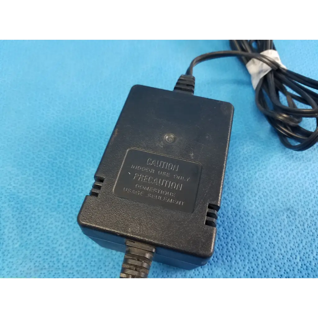 Black plastic boston acoustics dk1201a5-1an power supply with coiled cord and caution label for 12vac 1500ma output