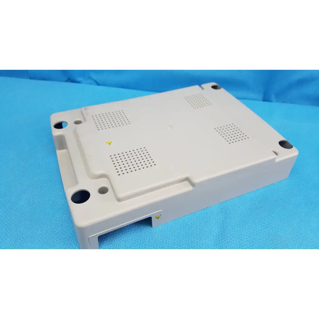 Beige base shroud plastic cover with ventilation grilles and mounting holes for trc-nw6s retinal camera