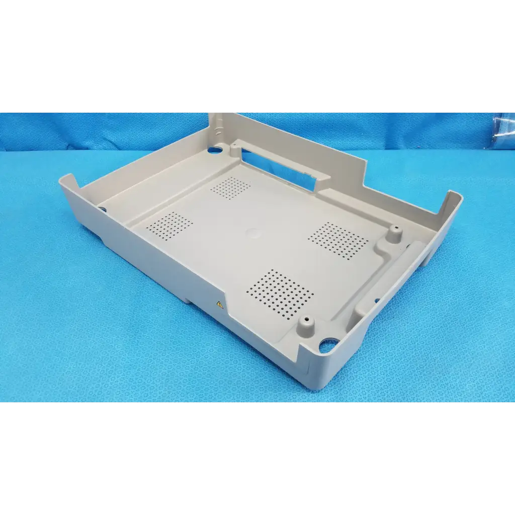 Beige plastic base shroud plastic cover panel with perforated ventilation and mounting holes for topcon trc-nw6s retinal camera
