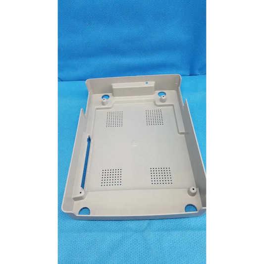 Beige base shroud plastic cover panel with perforations and mounting holes for trc-nw6s retinal camera