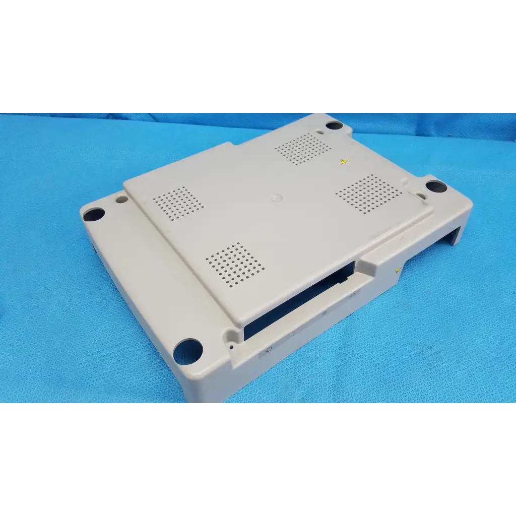 Beige base shroud plastic cover panel with ventilation and mounting holes for topcon trc-nw6s retinal camera back side