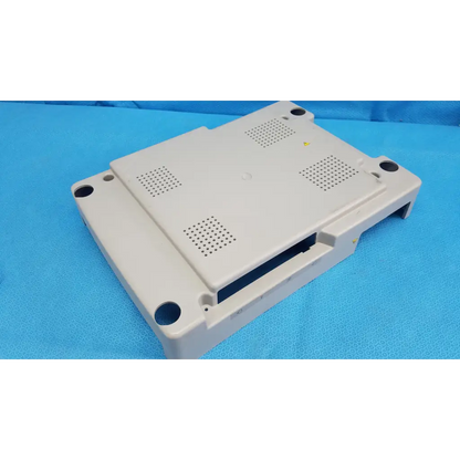 Beige base shroud plastic cover panel with ventilation and mounting holes for topcon trc-nw6s retinal camera back side